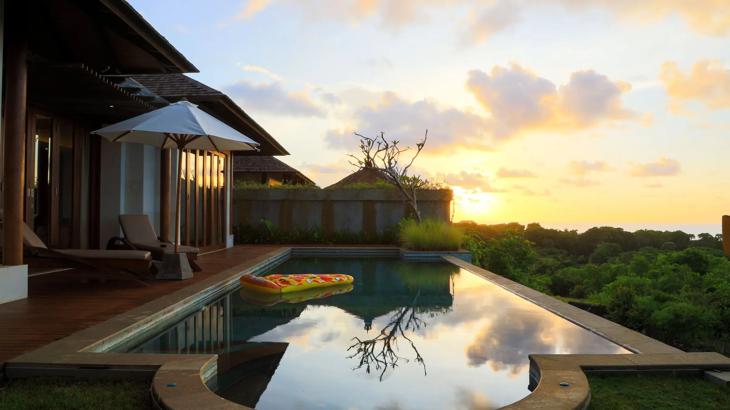Evening light over a tropical home with a pool